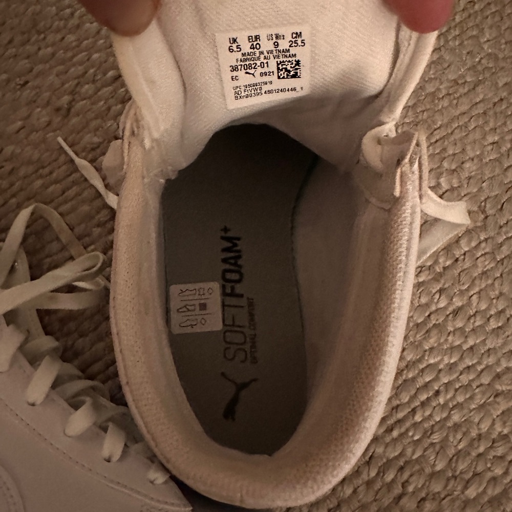 White and Black Sole Puma High Tops